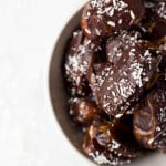 Almond Joy Dates: made with healthy ingredients like almond butter, unsweetened coconut, and a homemade chocolate sauce! These gluten free and vegan treats are the perfect summer snack or dessert, and they require only 6 ingredients! || fooduzzi.com recipe